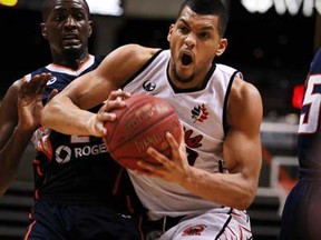 Windsor's Kevin Loiselle, centre, drives the ball to basket as the Windsor Express host the Summerside Storm in game 4 of their five game playoff series at the WFCU Centre, Saturday, March 30, 2013.  (DAX MELMER/The Windsor Star)