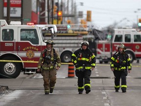 In this file photo, firefighters at the scene of a ruptured gas line at Goyeau and Wyandotte streets in Windsor, Ont. on Monday, March 11, 2013. (DAN JANISSE/The Windsor Star)