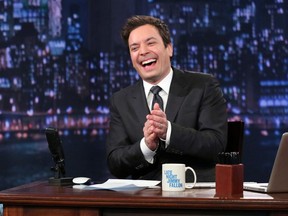 In this Feb. 21, 2013 file photo released by NBC, Jimmy Fallon, host of "Late Night with Jimmy Fallon," laughs on the set of his show in New York. NBC is building a new studio for Fallon and rumors are circulating that he may replace Jay Lenno on the Tonight Show in 2014. A Cuomo administration official says New York is trying to lure TV shows with its tax credits program and the "Tonight" show would qualify if it decides to move back to Manhattan. (AP Photo/NBC, Lloyd Bishop, File)