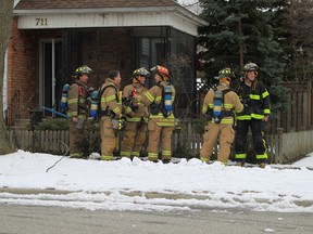 Windsor firefighters after fighting a fire in the 700 block of Kildare Road in Windsor, Ontario on March 1, 2013. (JASON KRYK/ The Windsor Star)