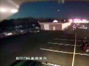 In this image taken from video provided by Tom Hopkins of Hopkins Automotive Group, a bright flash of light, top center, streaks across the early-evening sky in what experts say was almost certainly a meteor coming down, Friday, March 22, 2013 in Seaford, Del. Bill Cooke of NASA's Meteoroid Environmental Office said the flash appears to be "a single meteor event." He said it "looks to be a fireball that moved roughly toward the southeast, going on visual reports." (AP Photo/Hopkins Automotive Group)