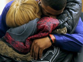 Ma'lik Richmond, top, hugs his mother Daphne Birden, after closing arguments were made on the fourth day of the juvenile trial for Ma'lik and co-defendant Trent Mays on rape charges on Saturday, March 16, 2013 in Steubenville, Ohio. The pair are accused of raping a 16-year-old West Virginia girl in August 2012. (AP Photo/Keith Srakocic, Pool)
