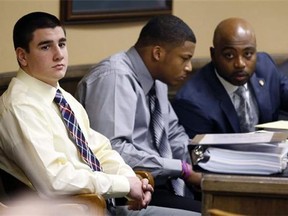 Trent Mays, 17, left, watches as 16-year-old Ma'lik Richmond talks with his attorney Walter Madison at the defense table before the start of their trial on rape charges in juvenile court on Wednesday, March 13, 2013 in Steubenville, Ohio. Mays and Richmond are accused of raping a 16-year-old West Virginia girl last August 2012 (AP Photo/Keith Srakocic, Pool)