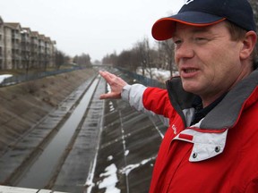 John Ouellette stands on the pedestrian bridge at Glenwood Avenue in South Windsor where he first noticed a chemical sheen on the water in the Grand Marais Drain. (Dax Melmer / The Windsor Star)