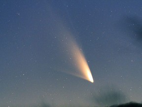 This March 2, 2013 photo made available by spaceweather.com shows the comet, Pan-STARRS, seen from Queenstown, New Zealand. The recently discovered comet is closer than it's ever been to Earth, and stargazers in the Northern Hemisphere finally get to see it. The comet passed within 100 million miles of Earth on Tuesday, March 5, 2013, its closest approach in its first-ever cruise through the inner solar system. The best viewing days should be next Tuesday and Wednesday, March 12 and 13, when Pan-STARRS appears next to a crescent moon at dusk in the western sky. Until then, glare from the sun will obscure the comet. (AP Photo/spaceweather.com, Minoru Yoneto)