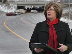 Cindy Prince stands on a section of the Herb Gray Parkway on March 27, 2013. (DAN JANISSE/The Windsor Star)