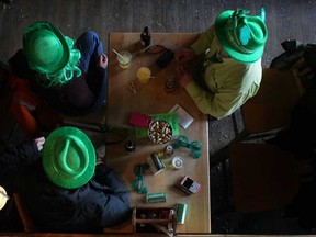 St. Patrick's Day revellers sport their green hats as they celebrate at the Rock Bottom Bar and Grill, Sunday, March 17, 2013.  (DAX MELMER/The Windsor Star)