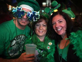 Jeff Taylor, left, Serena Hillman and Toni Taylor, celebrate St. Patrick's Day at the Kilt and Fiddle Irish Pub, Sunday, March 17, 2013.  (DAX MELMER/The Windsor Star)