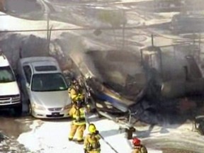 In this image taken from video, first responders work to extinguish burning vehicles after a small plane crashed into a parking lot near Fort Lauderdale Executive Airport in Fort Lauderdale, Fla. Friday afternoon, March 15, 2013, killing all three people onboard and burning about a dozen cars. No one on the ground was hurt. (AP Photo/APTN)