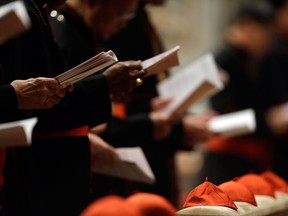 Cardinals gather in St. Peter's Basilica to attend a vespers celebration at the Vatican, Wednesday, March 6, 2013. (AP Photo/Gregorio Borgia)