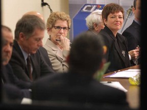 Premier Kathleen Wynne (centre) listens at a roundtable discussion on job creation with Windsor-Essex business leaders on Mar. 11, 2013. (Dan Janisse / The Windsor Star)