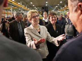 In this file photo, Ontario MPP Ontario Premier Kathleen Wynne meets employees of Centreline Windsor Ltd., Monday, March 11, 2013, in Lasalle, Ont. The premier was in town to talk job creation strategies. (DAN JANISSE/The Windsor Star)