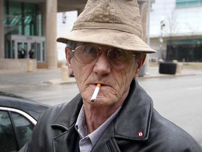Robert Mahon, 67, prepares to light up as he walks away from Superior Court in Windsor, Ont. Monday March 11, 2013. (NICK BRANCACCIO/The Windsor Star)