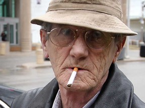 Robert Mahon, 66, prepares to light up as he walks away from Superior Court, Monday March 11, 2013. (NICK BRANCACCIO/The Windsor Star)