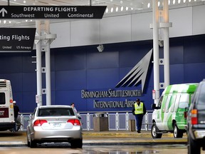 A flight information sign at the newly renovated Birmingham-Shuttlesworth International Airport in Birmingham, Ala., fell on a mother and her three children Friday afternoon, March 22, 2013, killing one child and injuring the mother and her two other children. (AP Photo/Tamika Moore, AL.com)