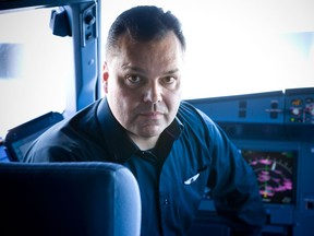 Rob Bendall sits in the left seat of an Airbus A320. Bendall, a former bush pilot from Winnipeg who works for Branson's Virgin America airline, might have the right stuff to fly in space. THE CANADIAN PRESS/ho-Chad Slattery