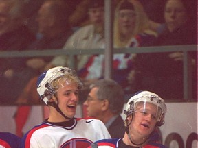In this 2001 file photo, Windsor's Jason Spezza, left, and Steve Hildenbrand celebrate a teammate's scoring chance during playoff action against Owen Sound at Windsor Arena. (Windsor Star files)