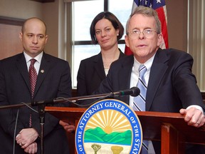 Ohio Attorney General Mike DeWine, right, answers questions about the successful prosecution of two juveniles in a rape case during a news conference Sunday, March 17, 2013, at the Jefferson County Justice Center in Steubenville, Ohio. Prosecutor Brian Deckert and Prosecutor Marianne Hemmeter joined DeWine. Judge Thomas Lipps ruled Sunday that Steubenville High School students Trent Mays, 17, and Ma'Lik Richmond, 16, were guilty of raping a 16-year-old Weirton, W.Va., girl after an alcohol-fueled party in August 2012. (AP Photo/Steubenville Herald-Star, Michael D. McElwain, Pool)