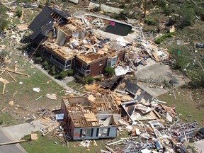 This aerial photo taken April 28, 2011 shows tornado damage in Pleasant Grove, Ala. The photos and mementoes that were blown for hundreds of miles during the tornado outbreak two years ago are giving researchers new insight on how debris is carried. University of Georgia associate professor John Knox says a new study has documented how one photo traveled nearly 220 miles through the atmosphere over Alabama and Tennessee. (AP Photo/Dave Martin, File)