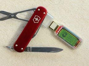 The Swiss Army Knife from Victorinox, seen here with a 128 gigabbyte drive at the International Consumer Electronics Show (CES) in Las Vegas, Nevada, on January 11, 2012. A decision on March 6, 2013 to scrap a post-9/11 ban on pocket knives being carried by passengers on US aircraft has triggered an angry backlash from pilots, flight attendants and airline chiefs. Starting from April 25, travelers will be able to carry small knives with folding blades on US planes following a shift in security strategy by the federal Transportation Security Administration. TSA chief John Pistole said the new guidelines would bring US security regulations into line with international standards and were designed to help airport staff find more dangerous items such as explosives. AFP PHOTO / Frederic J. BROWN