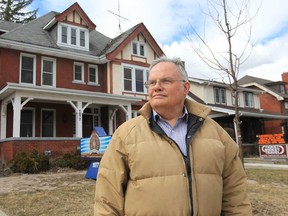 John Calhoun, the City of Windsor heritage planner, stands in front of a vacant home at 1077 Ouellette Avenue in Windsor, Ontario on March 27, 2013. (JASON KRYK/The Windsor Star)