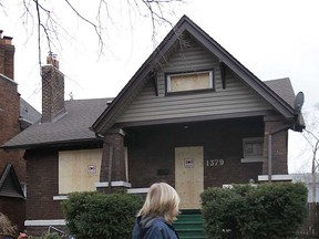 A boarded up house in the 1300 block of Victoria Avenue is shown Tuesday, March 12, 2013, in Windsor, Ont. One person in the home was injured during an early morning fire. (DAN JANISSE/The Windsor Star)