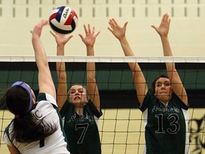 The Belle River Nobles Madison Dalley and Andie Suthers, right, try to block a shot from the Bishop Ryan Celtics Nancy Vincic during OFSAA girls volleyball action at Ecole Secondaire E.J. Lajeunesse in Windsor, Ont. on Tuesday, March 5, 2013.                   (TYLER BROWNBRIDGE / The Windsor Star)