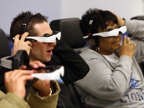 Students wear 3-D glasses and headphones during a training session at the World Class Manufacturing Academy in Warren, Michigan on Friday, March 1, 2013. Employees from across the Chrysler company come to the facility to train and work on real world problems.                   (TYLER BROWNBRIDGE / The Windsor Star)