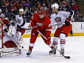In this file photo, Sergei Bobrovsky #72 of the Columbus Blue Jackets makes a save as Cory Emmerton #25 of the Detroit Red Wings is defended by Dalton Prout #47 of the Columbus Blue Jackets on March 9, 2013 at Nationwide Arena in Columbus, Ohio. (Photo by Kirk Irwin/Getty Images)