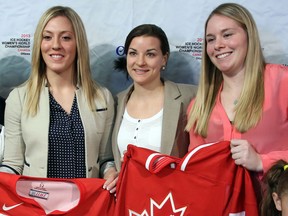 Ruthven's Meghan Agosta-Marcino, from left, Sarah Vaillancourt and Haley Irwin pose after Hockey Canada announced Canada's National Women's Team roster for the upcoming IIHF Ice Hockey Women's World Championship at a news conference in Ottawa. (THE CANADIAN PRESS/Fred Chartrand)