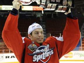 In the file photo, Stephen Johnston of the Windsor Spitfires hoists the Memorial Cup in Brandon in 2010. (CHL Images/Aaron Bell)