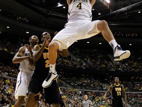 Michigan's Mitch McGary dunks against the Virginia Commonwealth Rams during the third round of the 2013 NCAA Men's Basketball Tournament at The Palace of Auburn Hills Saturday in Auburn Hills, Mich. (Photo by Gregory Shamus/Getty Images)