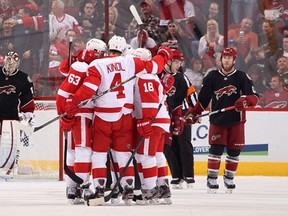 Detroit's Joakim Andersson, from left, Jakub Kindl and Ian White celebrate after White scored a first-period goal on Phoenix goaltender Jason LaBarbera at Jobing.com Arena in Glendale, Arizona.  (Photo by Christian Petersen/Getty Images)