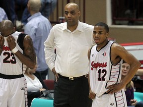 Windsor Express head coach Bill Jones, centre, stands on the sidlines with players Eddie Smith, left, and Darren Duncan in Game 3 against the Summerside Storm at the WFCU Centre. (NICK BRANCACCIO/The Windsor Star)