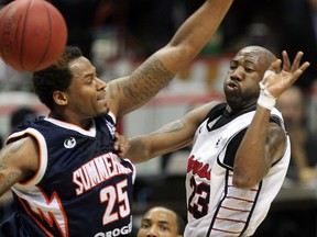 Windsor's Eddie Smith, right, drives the lane against Antwan Tisby of Summerside Storm in playoff action at the WFCU Centre. (NICK BRANCACCIO/The Windsor Star)