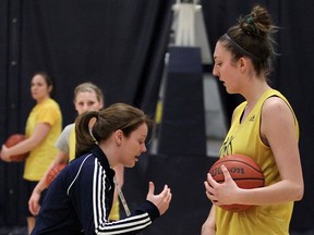 Lancers head coach Chantal Vallee, left, talks to forward Jessica Clemencon duirng a practice at the St. Denis Centre. (NICK BRANCACCIO/The Windsor Star)