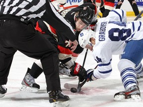 Ottawa's Kyle Turris, left, takes a faceoff against Toronto's Mikhail Grabovski Saturday at Scotiabank Place. (Photo by Jana Chytilova/Freestyle Photography/Getty Images)