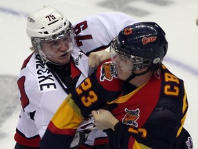 Windsor's Ty Bilcke, left, fights Erie's Connor Crisp at the WFCU Centre in October. (JASON KRYK/ The Windsor Star)