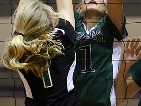 Belle River's Olivia King, right, blocks a shot against Patrick Fogarty's Heidi Hayes during OFSSA girls volleyball at Assumption. (TYLER BROWNBRIDGE/The Windsor Star)