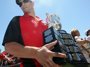 Adam Henrique carries the Memorial Cup to the stage during the Canada Day parade in 2010. (Windsor Star files)