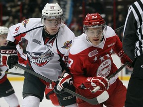 Windsor's Brady Vail, left, battles with the Soo's Nick Cousins at the WFCU Centre. (JASON KRYK/The Windsor Star)