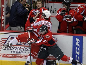 Windsor's Brady Vail, right, checks the Soo's Nick Cousins at the WFCU Centre. (TYLER BROWNBRIDGE/The Windsor Star)