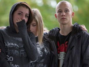 Young people gather at a memorial honoring teen Amanda Todd, who took her own life after being bullied, in Maple Ridge, B.C., Oct. 15, 2012. (Canadian Press files)