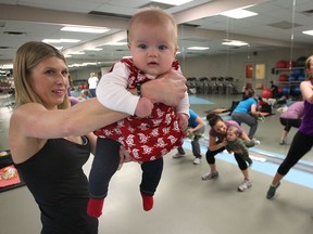 Terese Mingay and her daughter Sally lead a Mommy Boot Camp workout at the Windsor Squash and Fitness Club. The program allows new mothers the chance to exercise with their youngsters. (DAN JANISSE / The Windsor Star)