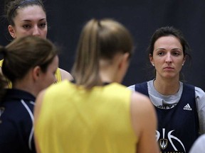 Lancers veteran Bojana Kovacevic, right, listens to head coach Chantal Vallee at St. Denis Centre, March 12, 2013.  (NICK BRANCACCIO/The Windsor Star)