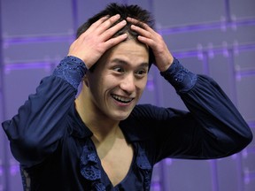 Patrick Chan, competing for Canada, reacts while awaiting his scores in the Men's Short Program during the 2013 World Figure Skating Championships in London, Ontario, Canada, March 13, 2013. AFP PHOTO/ BRENDAN SMIALOWSKI/ Getty Images