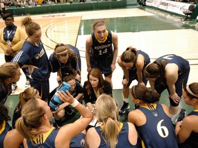 Windsor Lancers head coach Chantal Vallee, centre, instructs her team during the CIS women's basketball final at the University of Regina Sunday March 17, 2013.  (Michael Bell/Leader-Post)