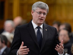 Prime Minister Stephen Harper rises during Question Period in the House of Commons on Parliament Hill in Ottawa, March 21, 2013 . (/Adrian Wyld/The Canadian Press)