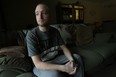 Dave Thomas is photographed in his home in Windsor on Tuesday, February 26, 2013. Thomas survived an accident that almost claimed his live.                  (TYLER BROWNBRIDGE / The Windsor Star)