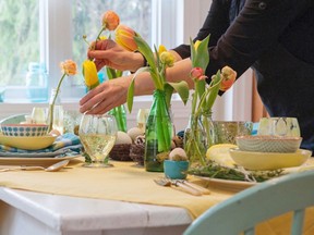 Think spring with pastel colours for dishes and linens plus flowers and a whimsical nest with eggs. (Peter McCabe /Postmedia News)